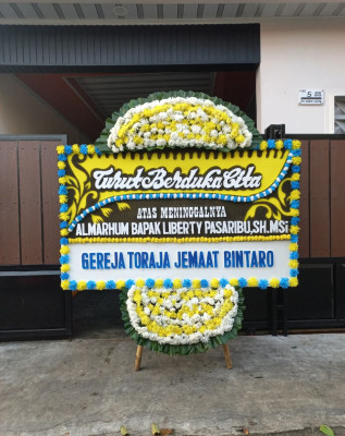 Papan Bunga Duka di Wanea